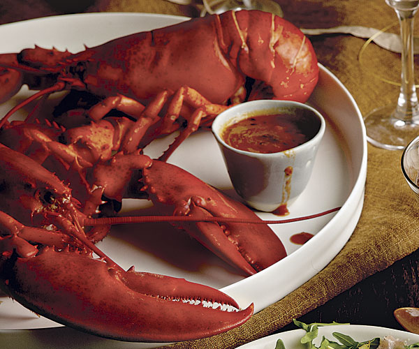 Vodka-Steamed Lobsters with Tomato-Thyme Butter Sauce
